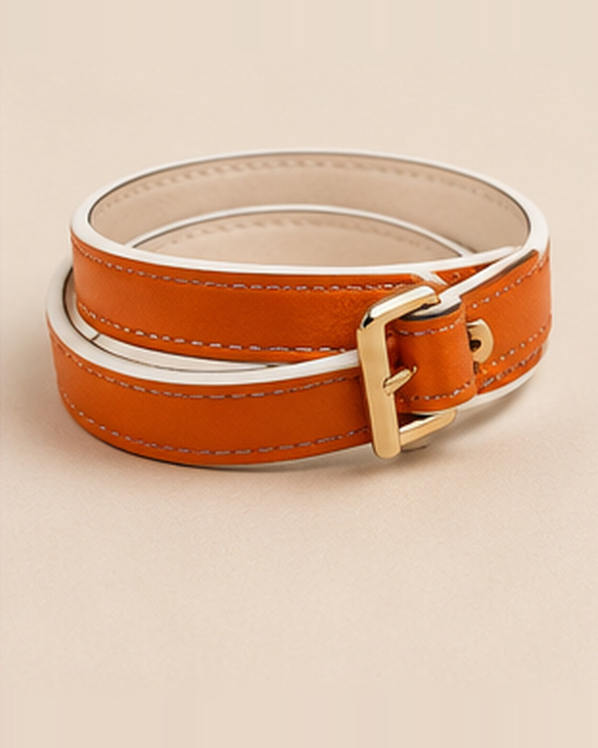 La Pétillante, orange leather with white edges