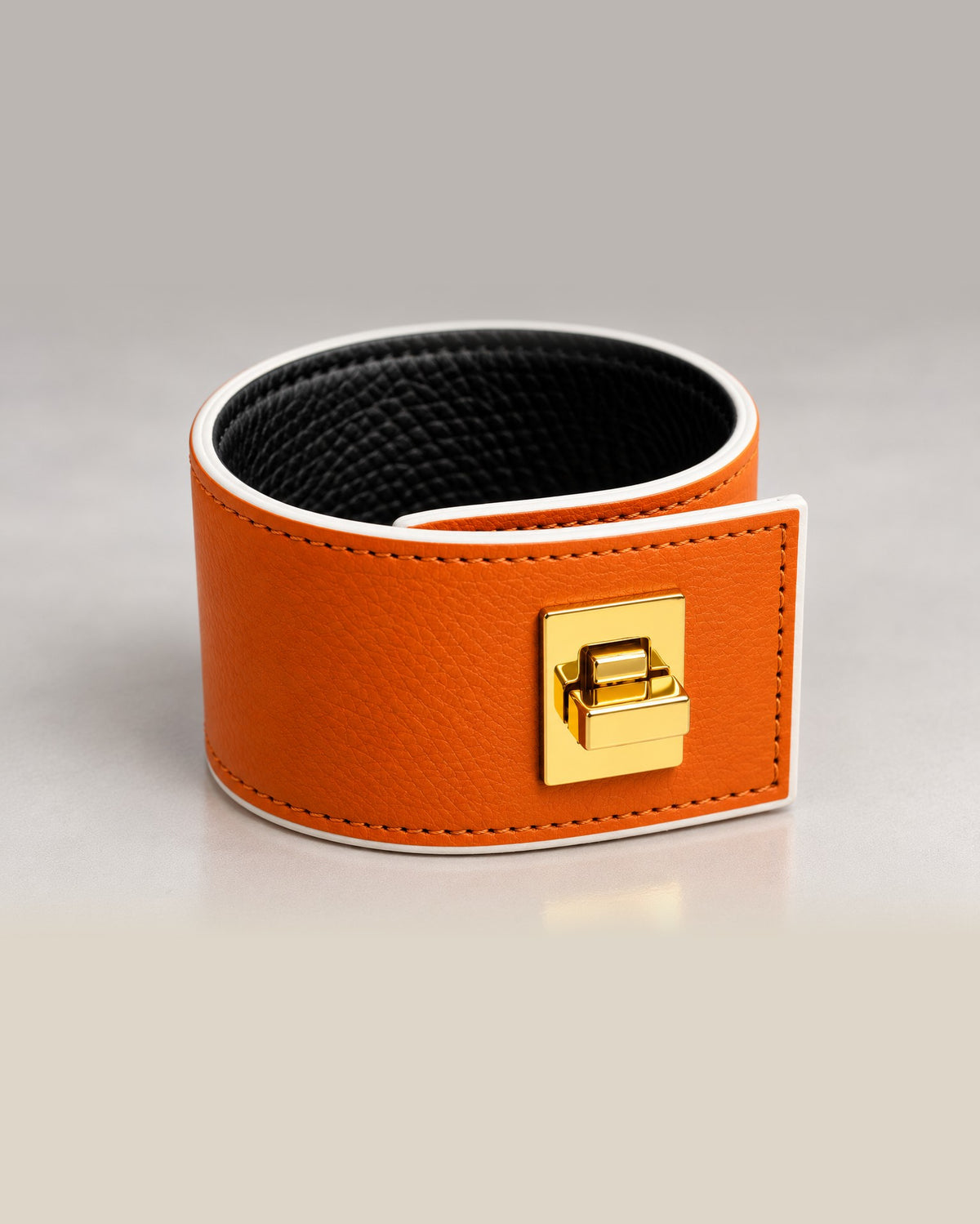 L'Élégante, orange leather with white edges